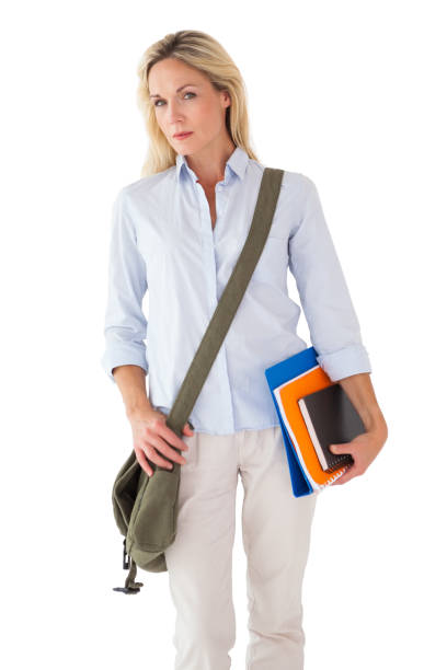 istock Blonde mature student carrying bag and books 816901656