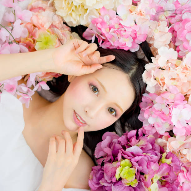 istock girl in flowers sleeping spa 816903590