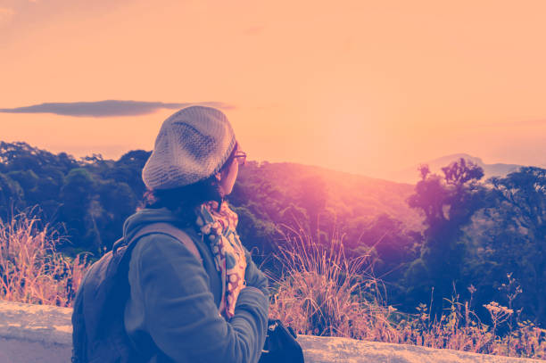 istock Female tourist standing and looking morning sunlight. 816910032