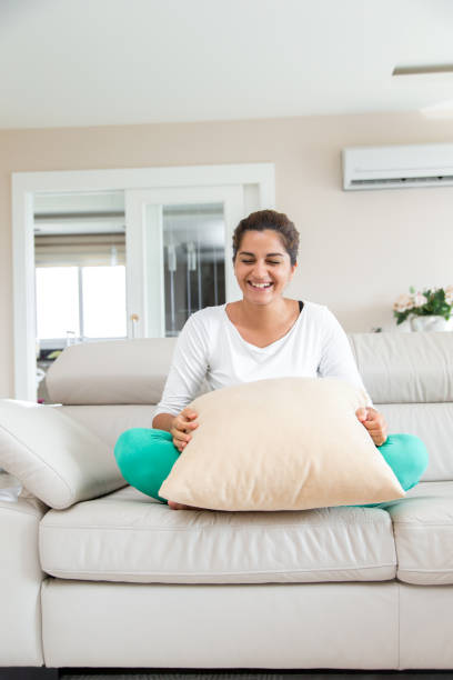 istock Young woman in livingroom 816910366