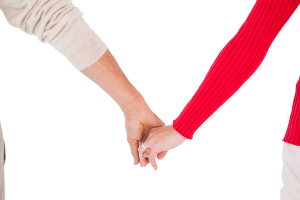 istock Couple holding hands rear view 816941840