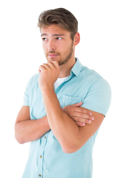 istock Handsome young man thinking with hand on chin 816944304