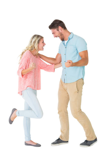 istock Attractive couple smiling and cheering 816968278