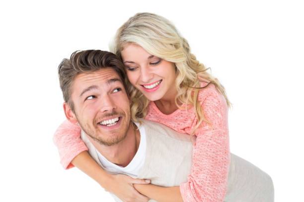 istock Handsome man giving piggy back to his girlfriend 816968490