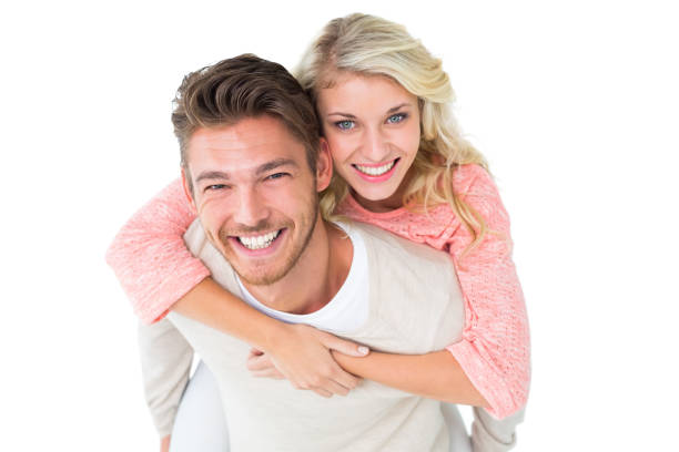 istock Handsome man giving piggy back to his girlfriend 816968514