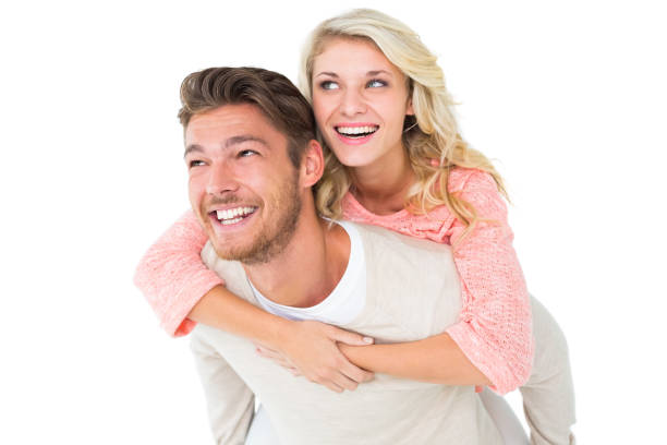 istock Handsome man giving piggy back to his girlfriend 816968558