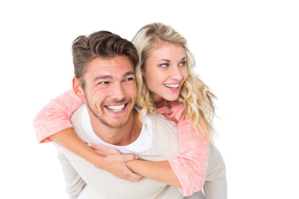 istock Handsome man giving piggy back to his girlfriend 816968692