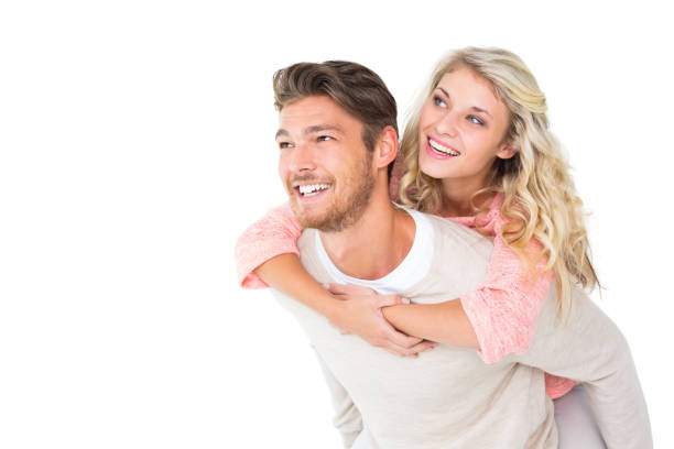 istock Handsome man giving piggy back to his girlfriend 816968706