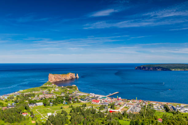 A look at the small town of Percé and its famous Rocher Percé (Perce Rock), part of Gaspe peninsula in Québec. Travel photography. gulf of st lawrence photos stock pictures, royalty-free photos & images