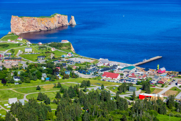 A look at the small town of Percé and its famous Rocher Percé (Perce Rock), part of Gaspe peninsula in Québec. Travel photography. gaspe peninsula stock pictures, royalty-free photos & images