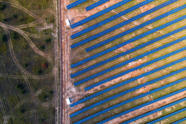 istock Solar panels placed on a countryside meadow. 816997128