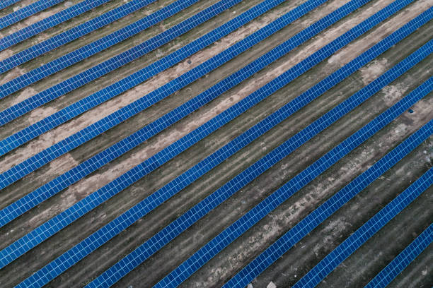 istock Solar panels placed on a countryside meadow. 816997218