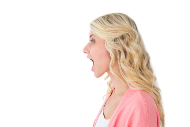 istock Pretty young blonde shouting with mouth open 817007542