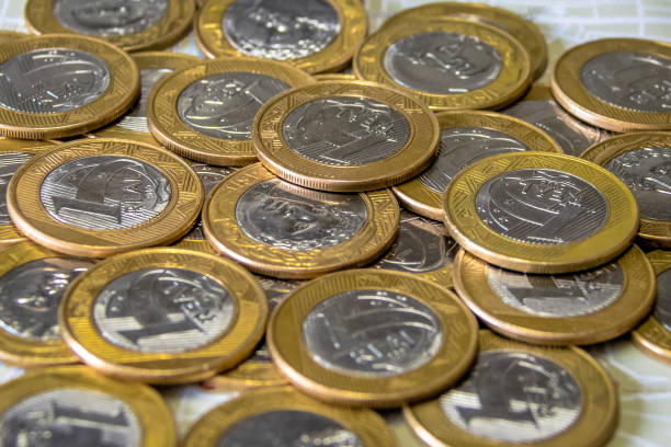 istock Brazilian currency - One Real coins 817007764
