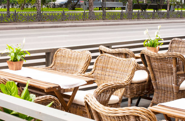 istock Thatched chairs in a cafe in a European style 817012874