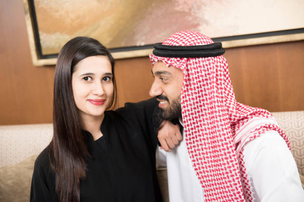 istock Arab couple at home sitting 817012978