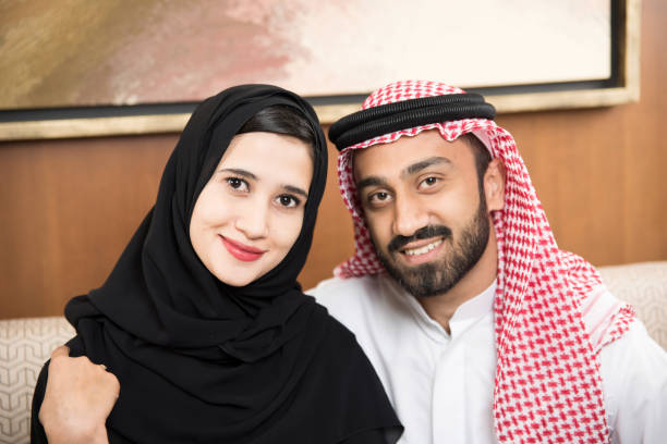 istock Arab couple at home sitting 817013012