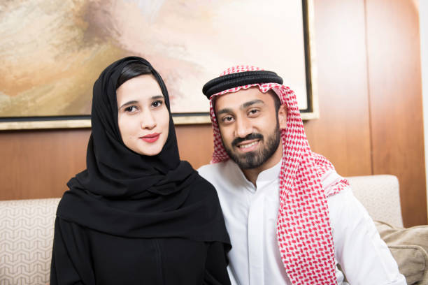 istock Arab couple at home sitting 817015664