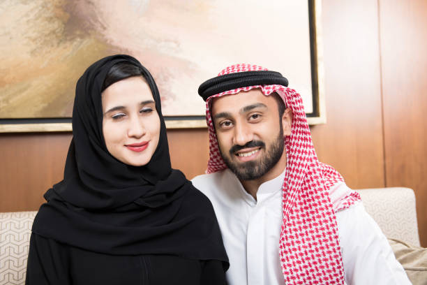 istock Arab couple at home sitting 817015666