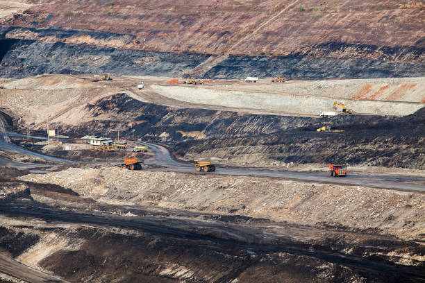 istock Part of a pit with big mining truck working 817019126