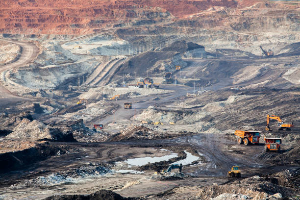 istock Part of a pit with big mining truck working 817019128