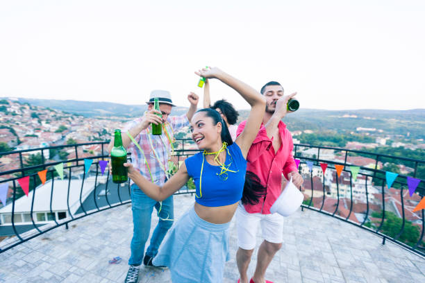 istock Friends having fun on roof party 817026316