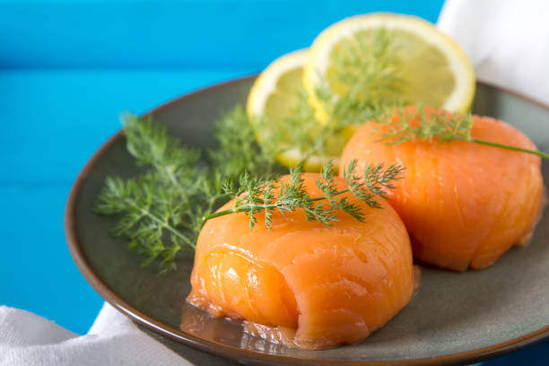 istock Smoked salmon, mousse, pate with dill and lemon. Dark background 817036916