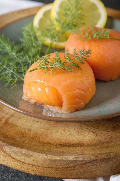 istock Smoked salmon, mousse, pate with dill and lemon. Dark background 817036982