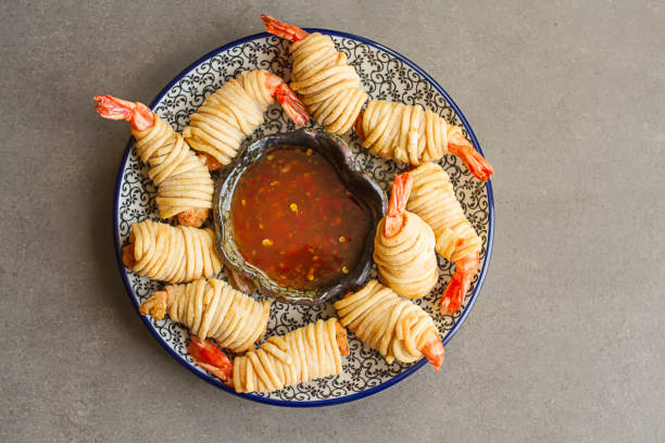 istock Fried rolls with prawns, served with sweet chili sauce and chops 817037012