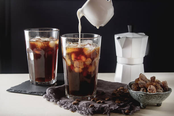 istock Iced coffee with milk. Summer drink. Dark background. 817037124