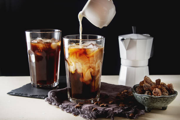 istock Iced coffee with milk. Summer drink. Dark background. 817037186