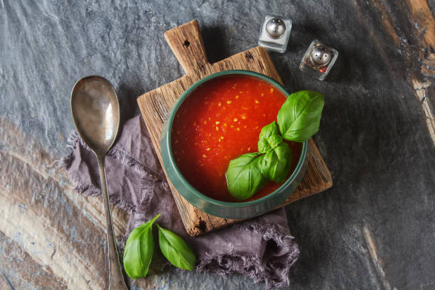 istock Traditional Italian tomato soup gazpacho with basil. Dark backgr 817037222