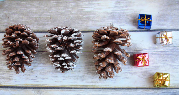 istock three Pine cones and little gifts around 817040066