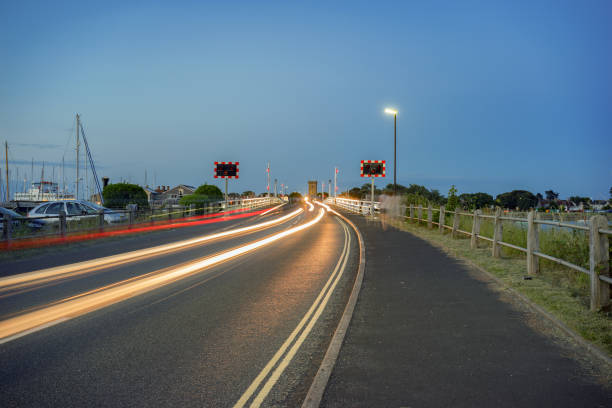 Cars pass across the Yarmouth bridge which spans the River Yar at Yarmouth on the Isle of Wight