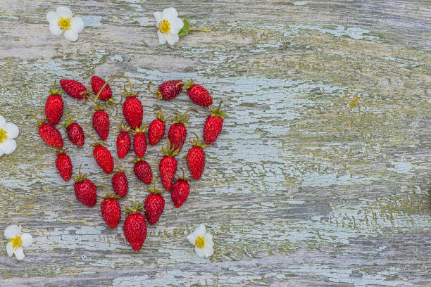istock alpine or woodland strawberries heart 817054702