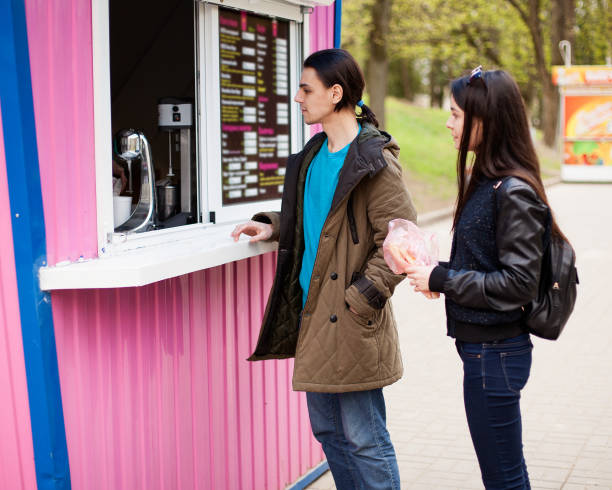 istock Lunch time. Young couple buying coffee 817059376