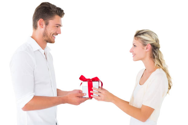 istock Attractive young couple holding a gift 817065372