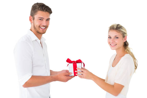 istock Attractive young couple holding a gift 817066494