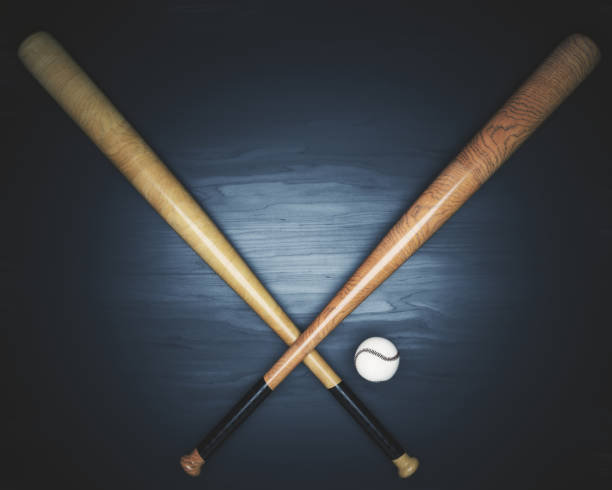 istock Baseball equipment on dark wooden surface 817066508