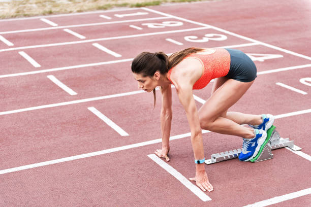 istock Serious young woman preparing for jogging 817071884
