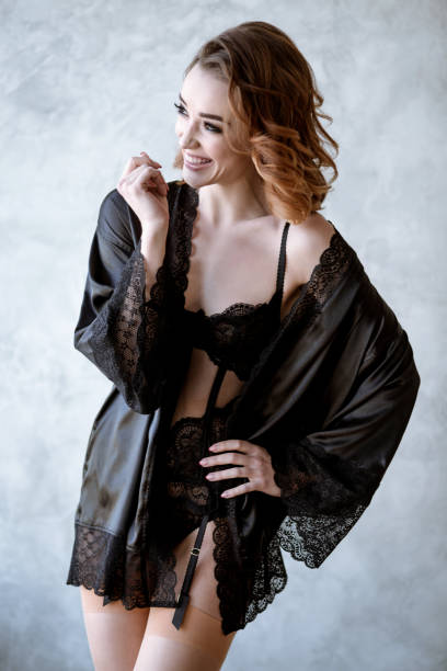 istock Beautiful sexy lady in elegant black robe 817076892