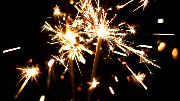 istock Burning Sparklers. Christmas and New Year lights. 817078996