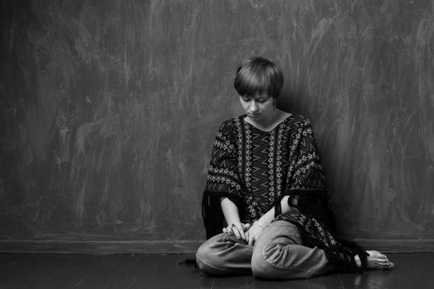 istock Domestic violence - victim  sitting on the floor 817087042