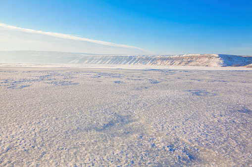 winter landscape with frozen lake surface