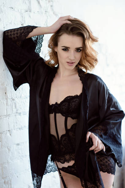 istock Beautiful sexy lady in elegant black robe 817094366