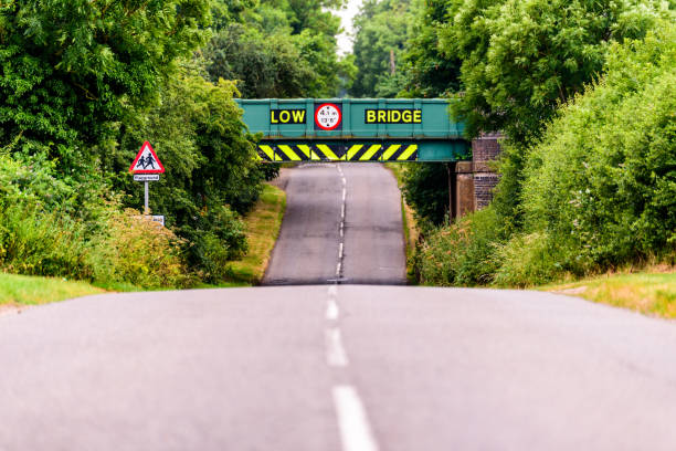 day view of uk motorway highway under railway bridge - non urban scene railroad track station day imagens e fotografias de stock