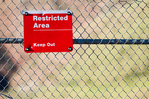 Sign indicating it is a restricted area and all are to keep out.