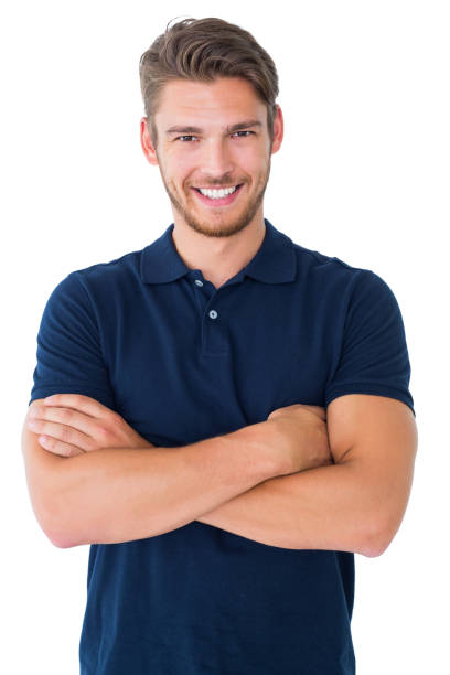 handsome young man smiling with arms crossed - stubble imagens e fotografias de stock