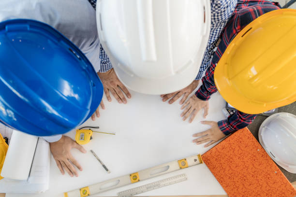 istock Group of young engineers or architects working in the office. engineers or architects meeting and planning project. Top view 817130792