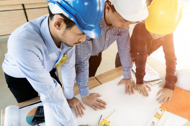 istock Asian engineer or architect meeting for architectural project. working with partner and engineering tools on workplace. Engineer or architect meeting for discussing design project. 817130796